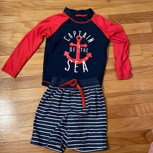 Boys size 4t swimsuit set. Rashguard and trunks. Says "captain of the sea."